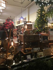 Trove A holiday window display with vintage radios and clocks.
